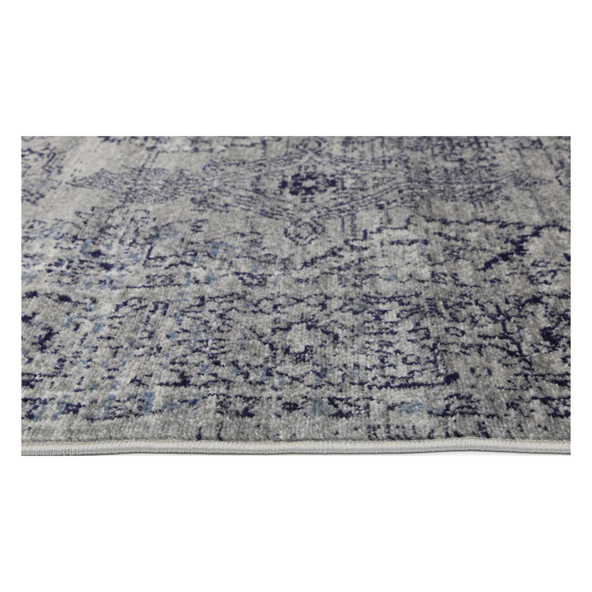Border texture detail of Arya charcoal traditional rug showing grey ornamental pattern