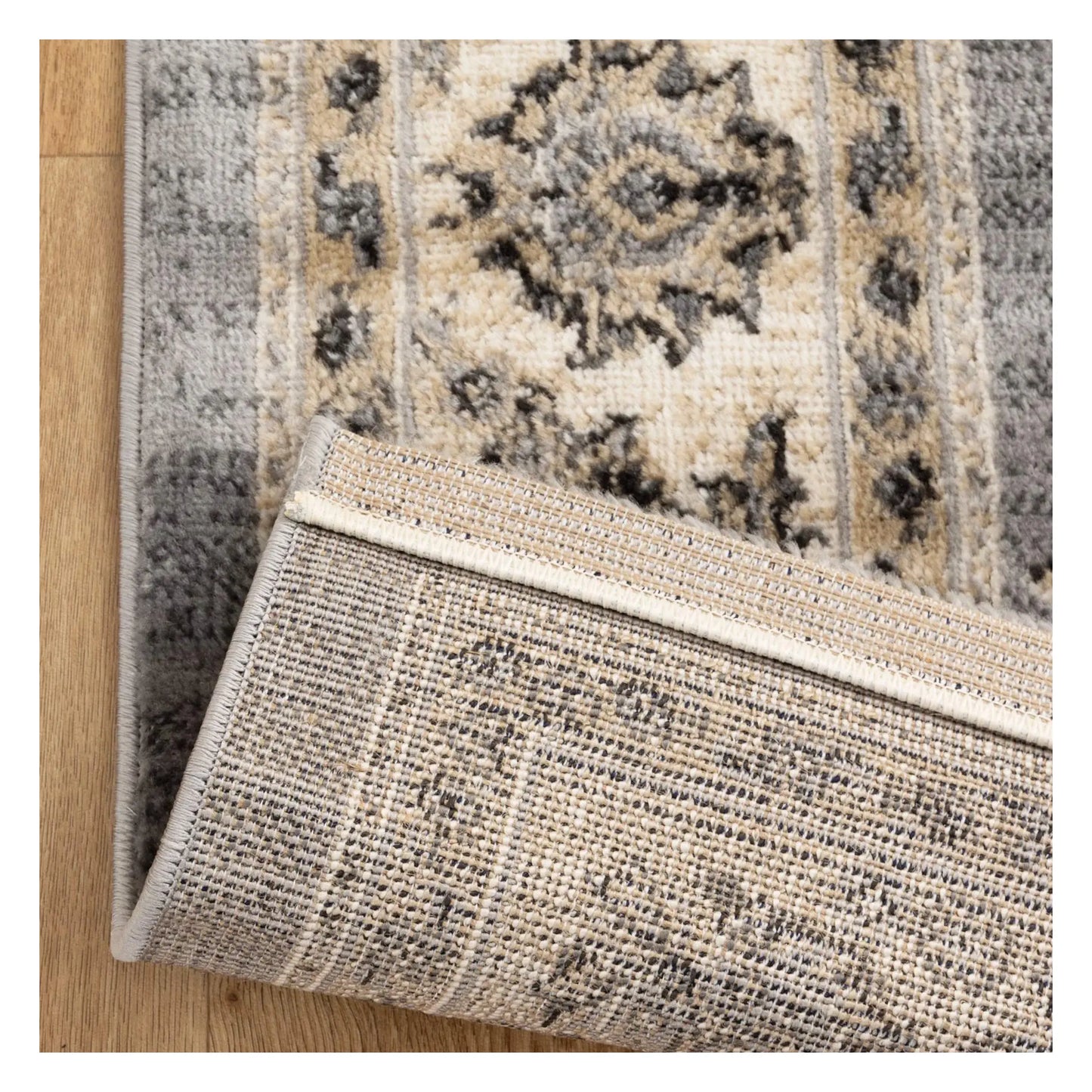 Backing detail of Arya grey traditional floral rug showing underside and woven surface