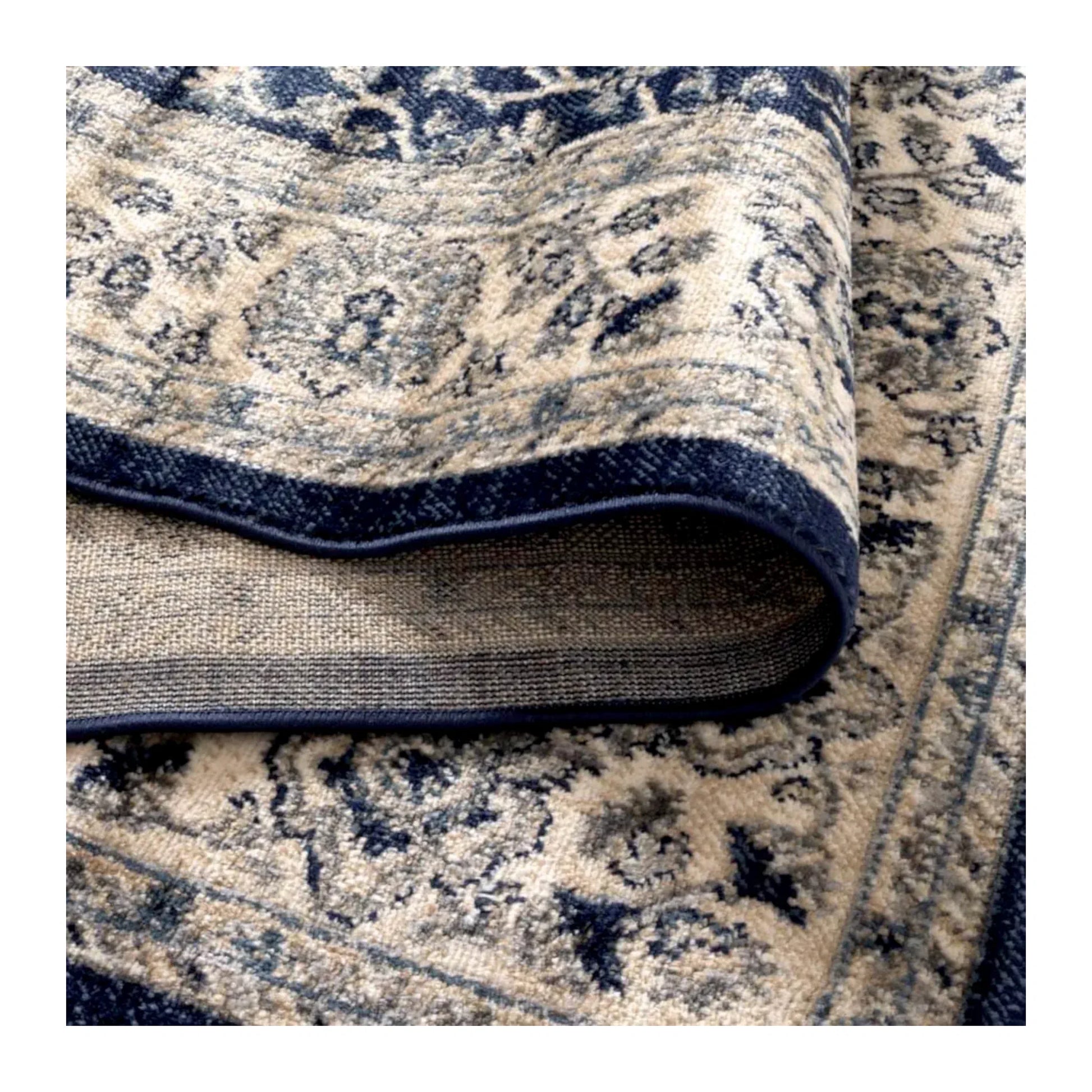 Arya Ziegler navy rug folded texture detail