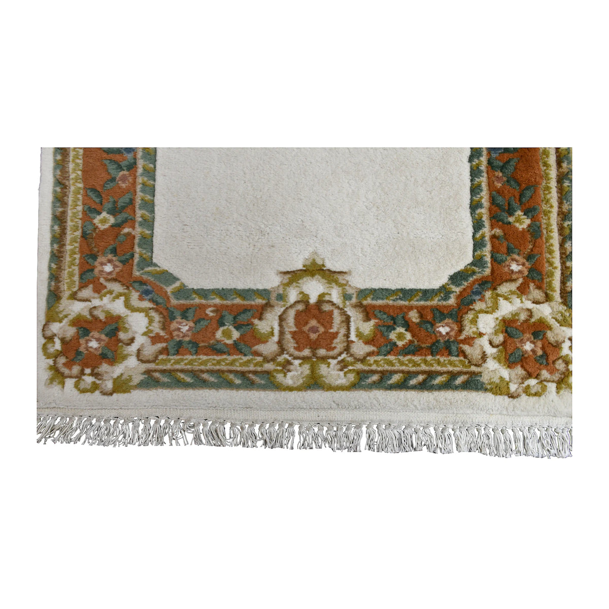 Fringe and end-border detail of Aubusson rug with terracotta, green and gold floral scrollwork