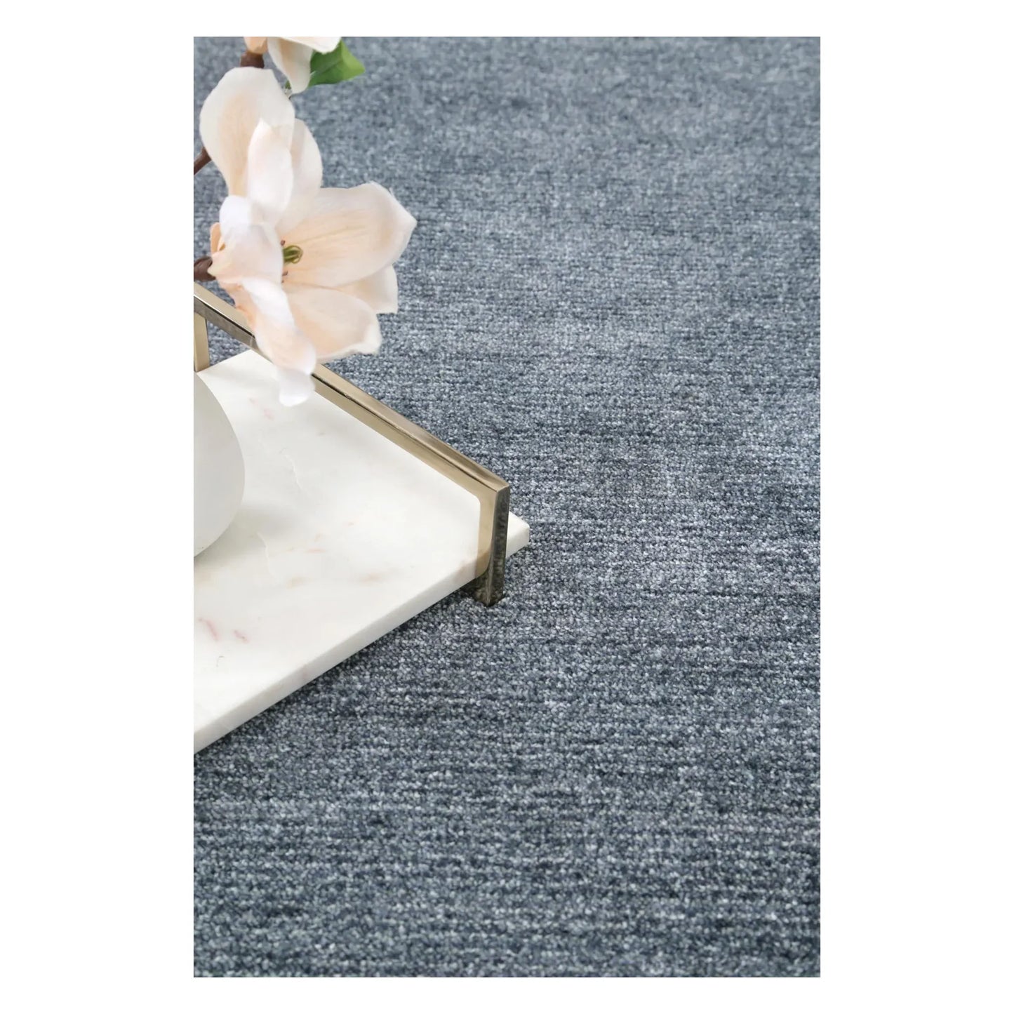 Styled close-up of Baltimore Chobi Ocean grey rug showing soft surface texture