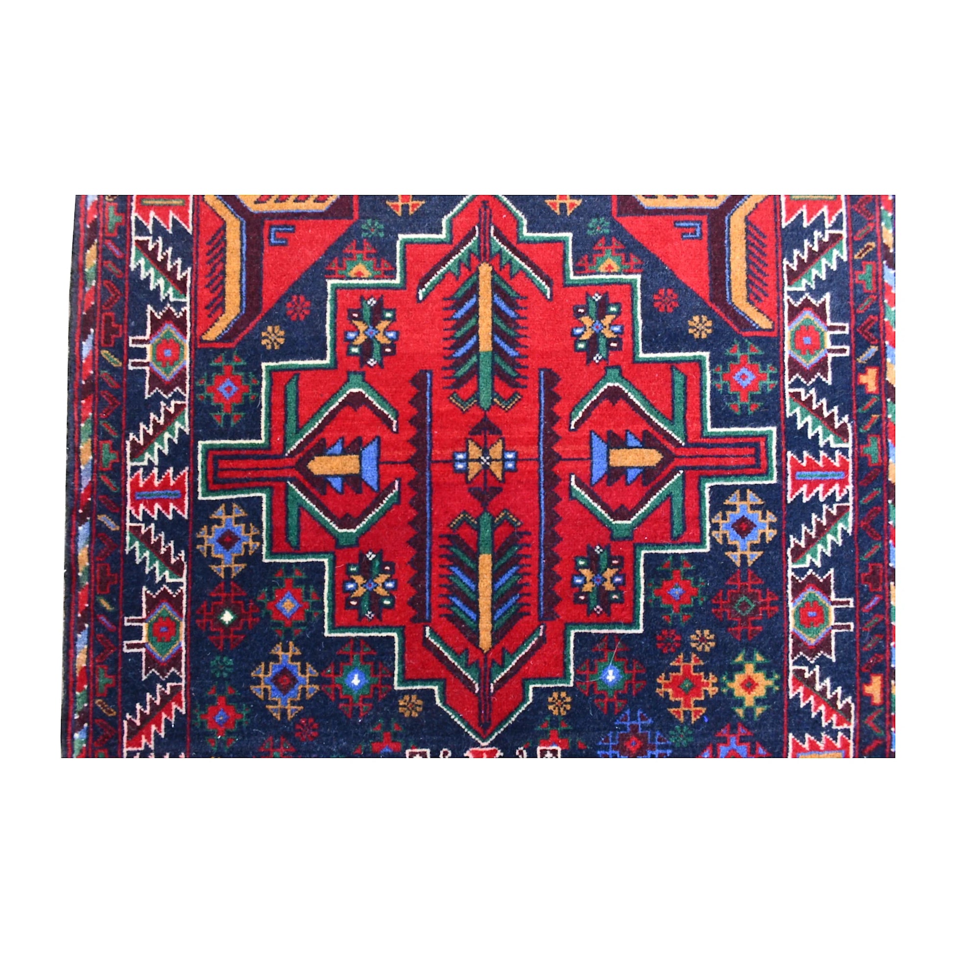 Close-up of Baluchi runner showing a large red central medallion with teal, ivory and dark geometric outlines