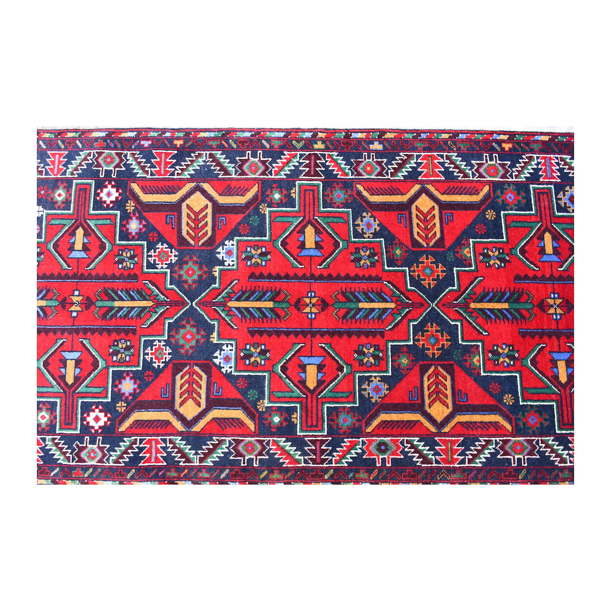 Close-up of Baluchi runner showing red, navy, teal and ivory tribal geometry across the field and borders