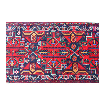 Close-up of Baluchi runner showing red, navy, teal and ivory tribal geometry across the field and borders