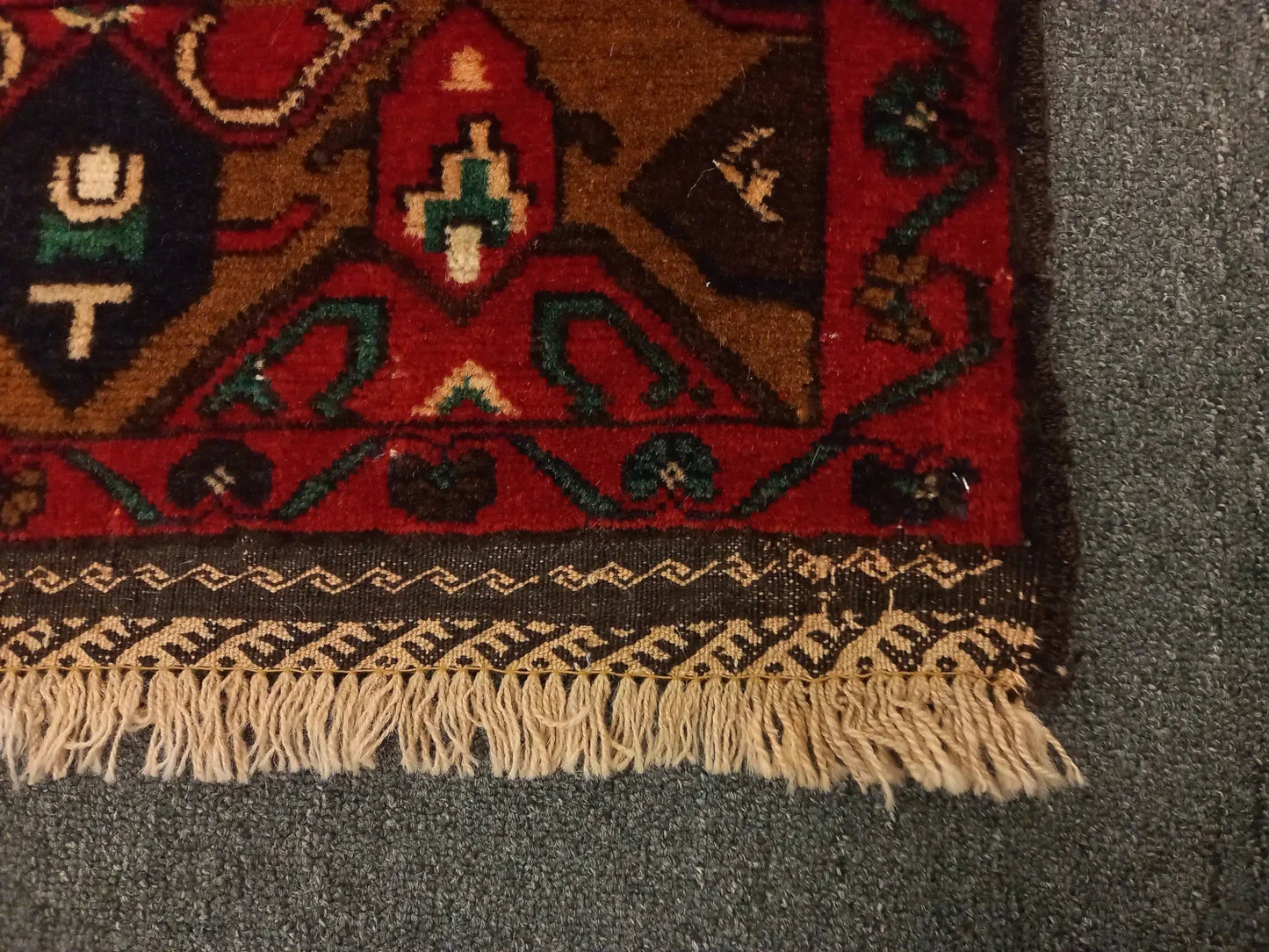 Baluchi rug border and fringe detail