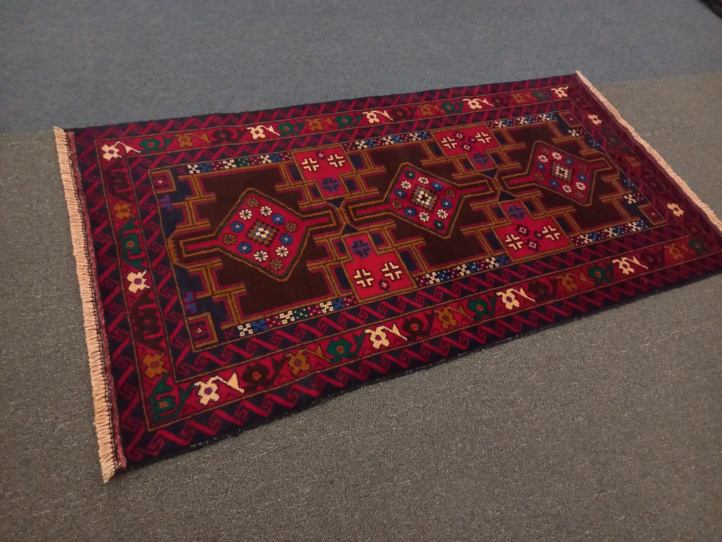 Baluchi hand-knotted wool rug 190 x 102 cm angled view