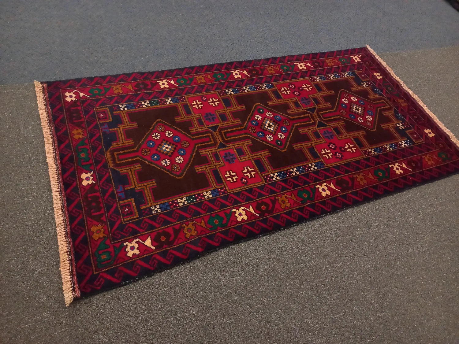 Baluchi hand-knotted wool rug 190 x 102 cm angled view
