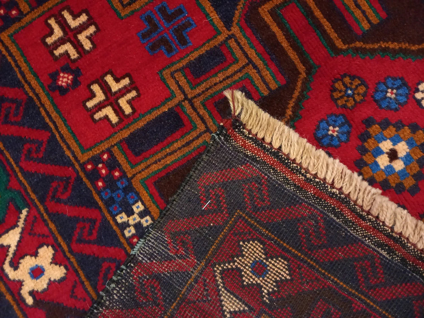Baluchi hand-knotted wool rug 190 x 102 cm edge and fringe detail