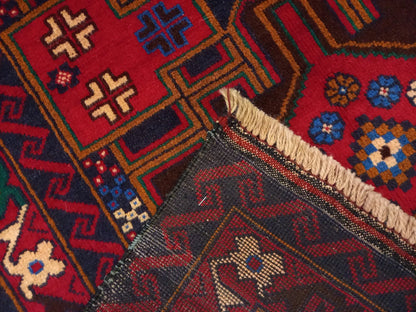 Baluchi hand-knotted wool rug 190 x 102 cm edge and fringe detail