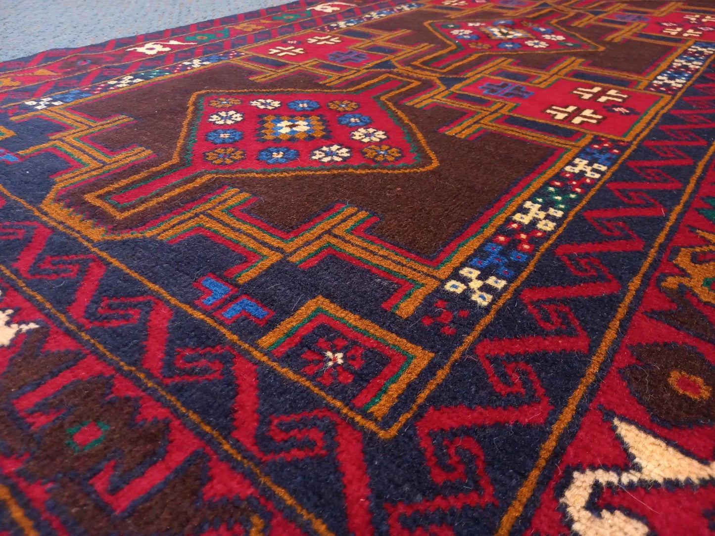 Baluchi hand-knotted wool rug 190 x 102 cm low angle surface view