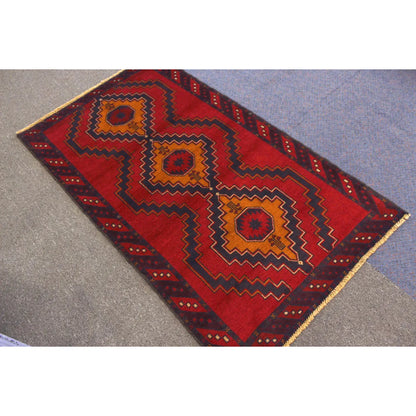 Baluchi hand-knotted wool rug 194 x 115 cm angled view