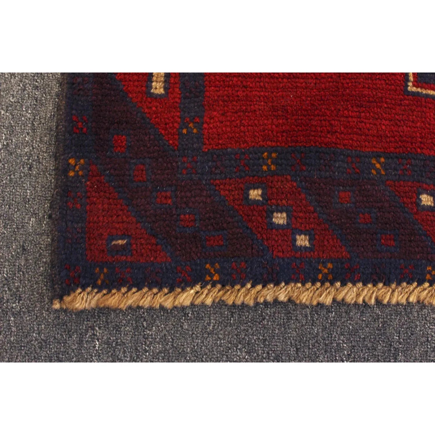 Baluchi hand-knotted wool rug 194 x 115 cm fringe and lower field detail