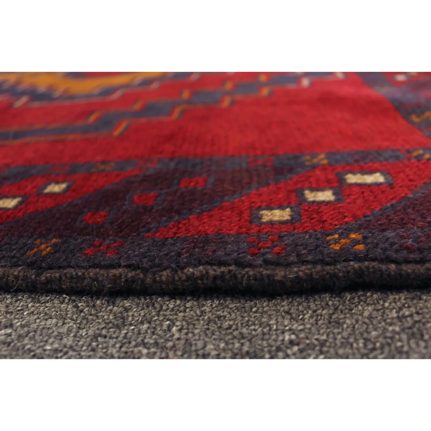 Baluchi hand-knotted wool rug 194 x 115 cm side view showing wool pile texture