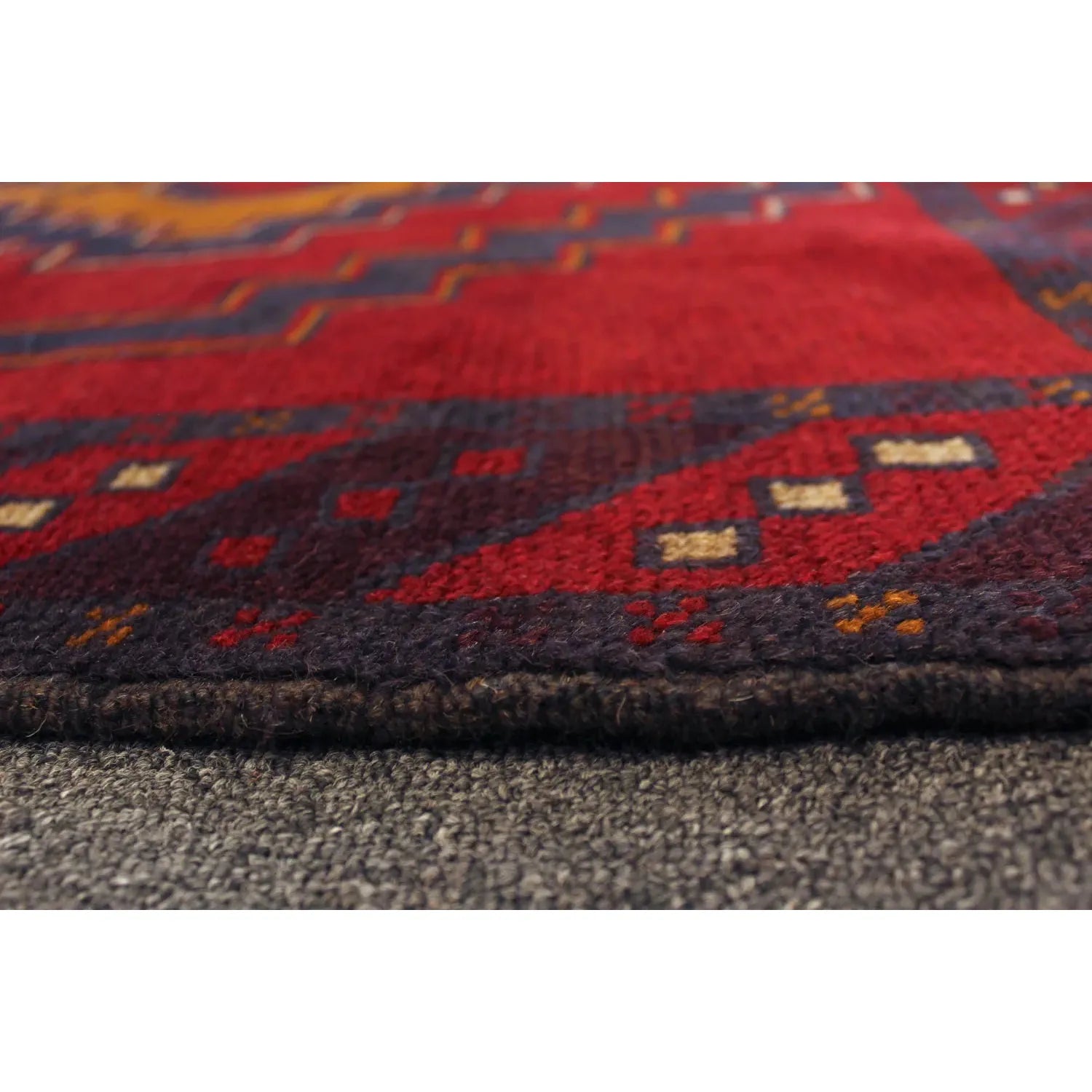 Baluchi hand-knotted wool rug 194 x 115 cm side view showing wool pile texture