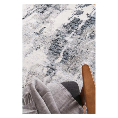 Styled close-up of Bergen blue and grey abstract rug showing soft surface texture