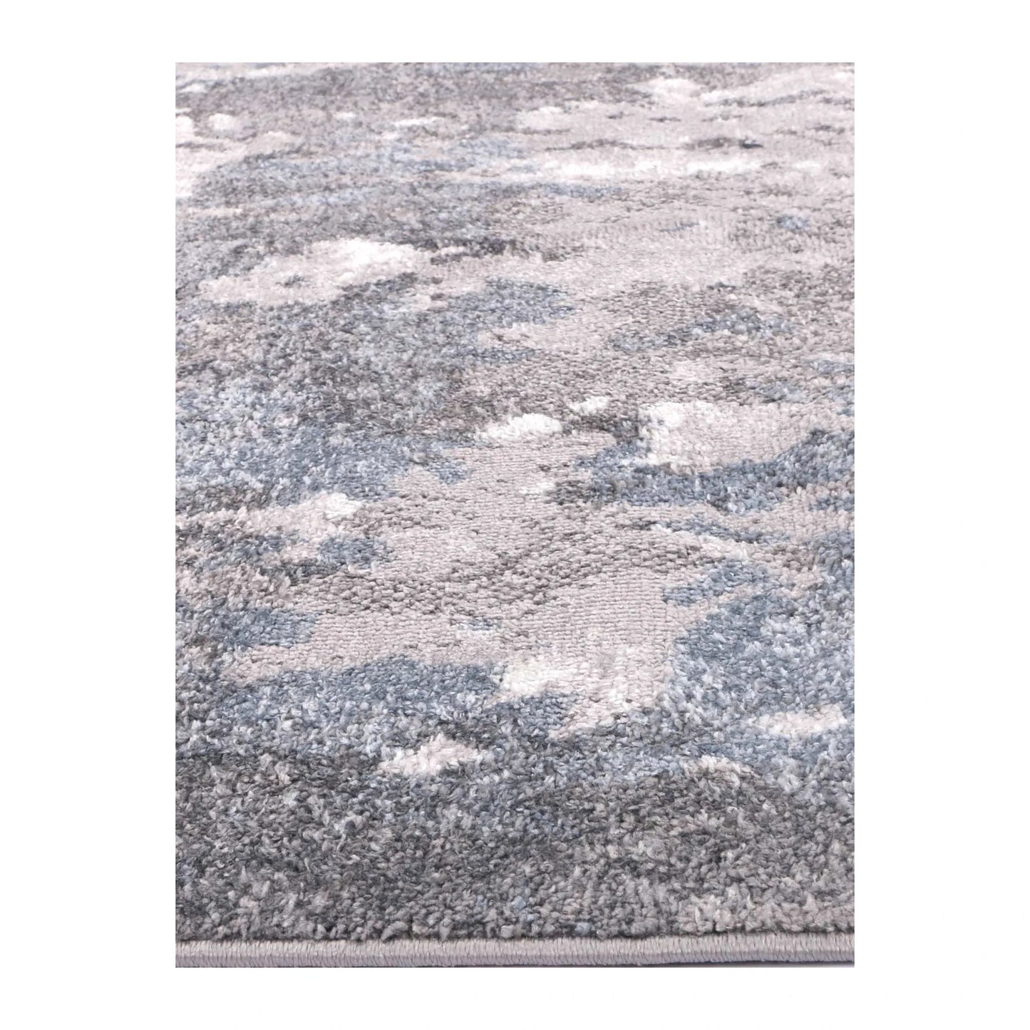 Angled full view of Bergen grey blue abstract rug showing abstract surface design