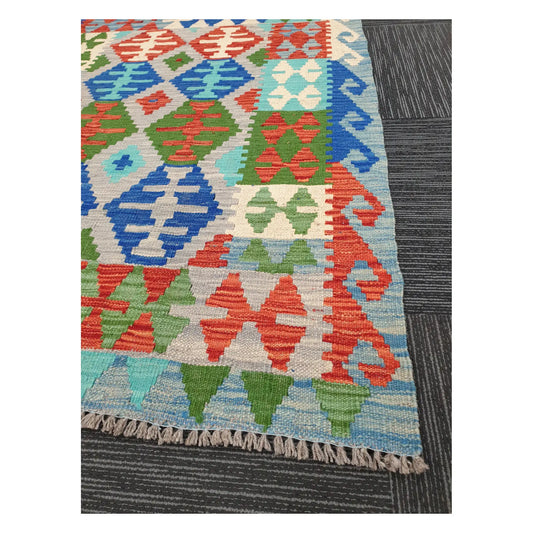 Angled detail of Afghan Chobi Kilim showing fringe, border pattern, and handwoven flatweave texture, 144 x 105 cm