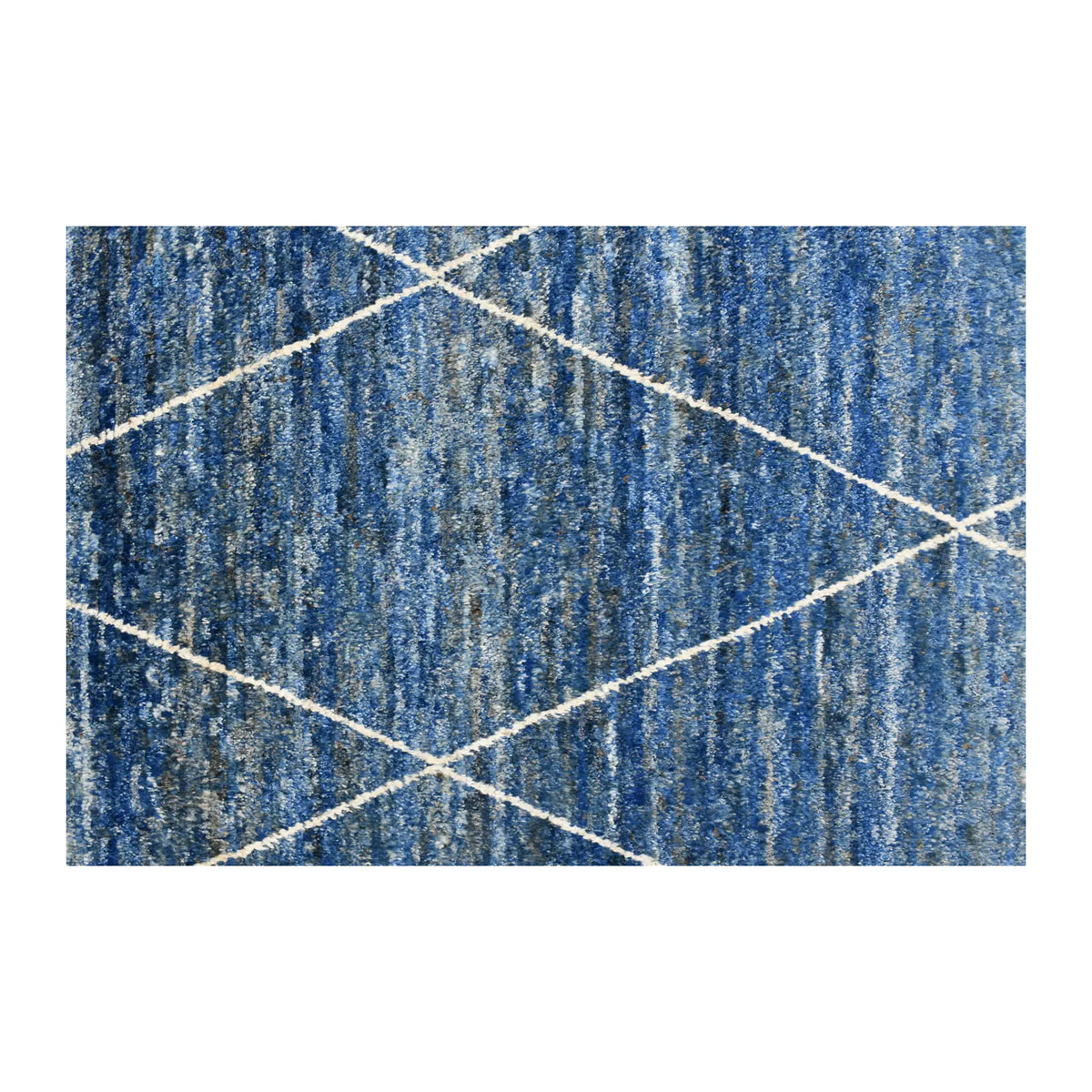 Field detail of blue Moroccan rug showing an ivory diamond lattice across cobalt, blue-grey and muted teal striations