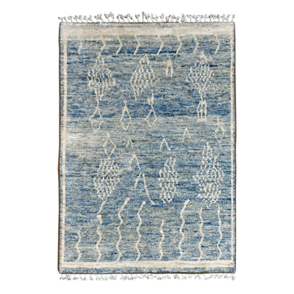Full view of blue Moroccan hand-knotted wool rug with raised ivory abstract motifs, 240 x 156 cm