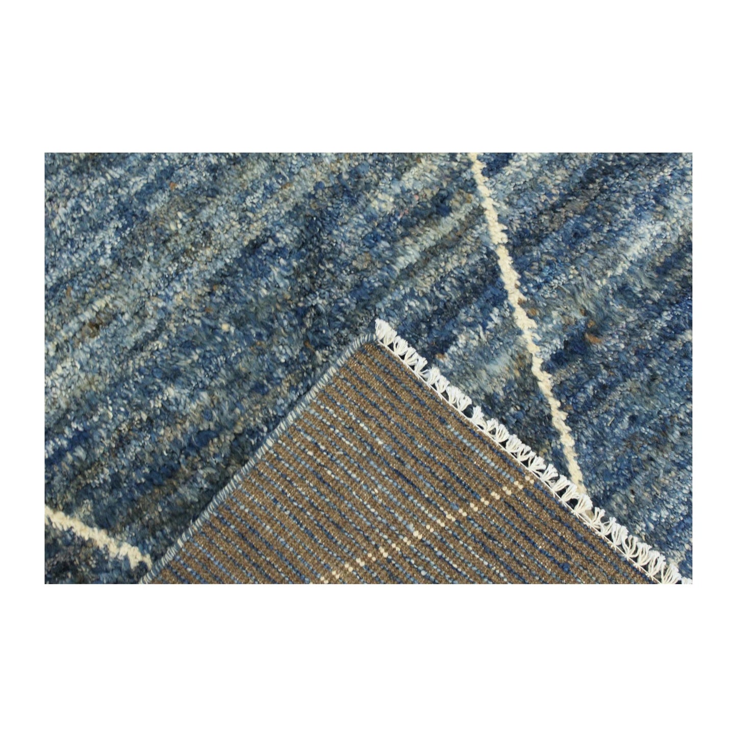 Folded corner detail of Moroccan wool rug showing pile and reverse weave, 180 x 140 cm