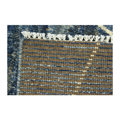 Reverse weave detail of Moroccan hand-knotted wool rug with fringe, 180 x 140 cm