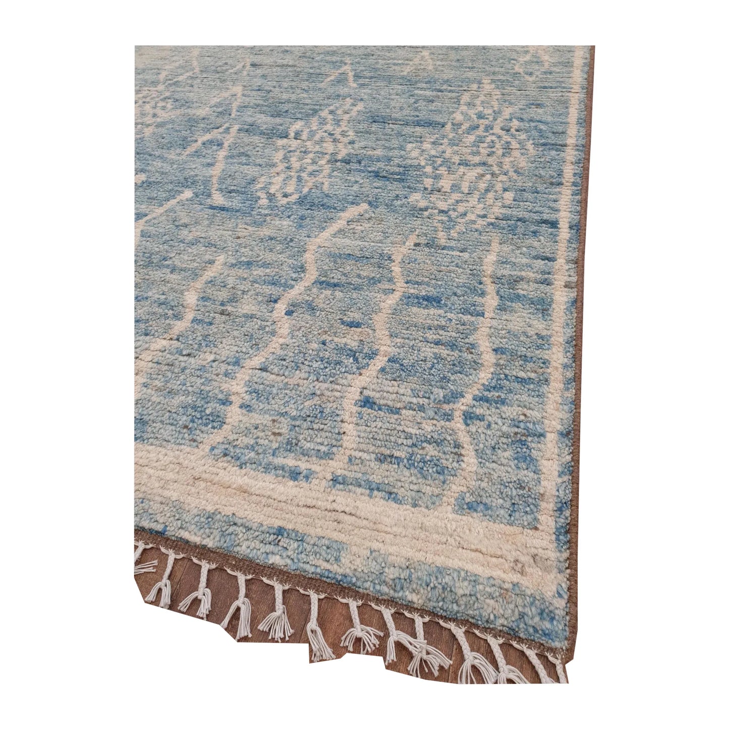Corner and fringe detail of blue Moroccan wool rug, 240 x 156 cm