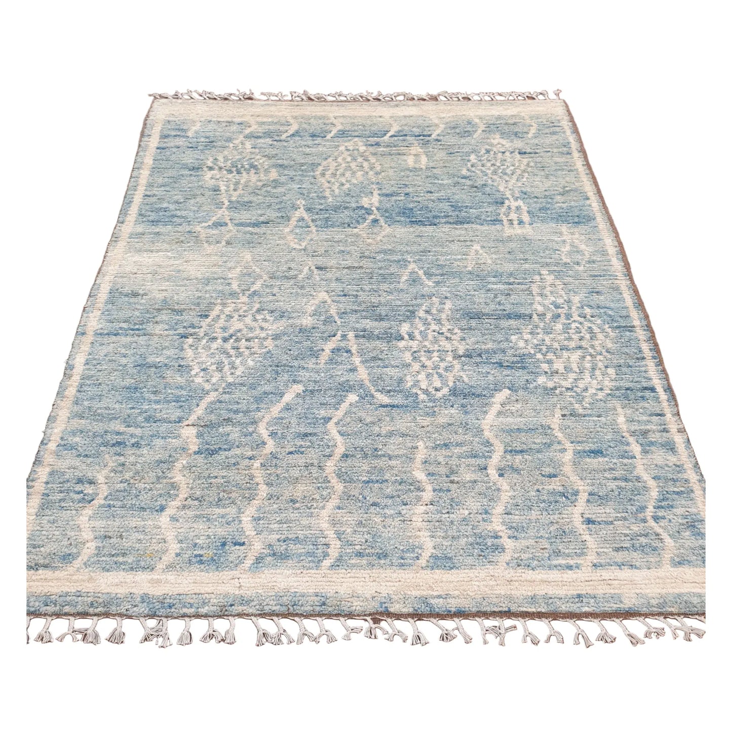Full view of blue Moroccan wool rug with raised ivory motifs, 240 x 156 cm