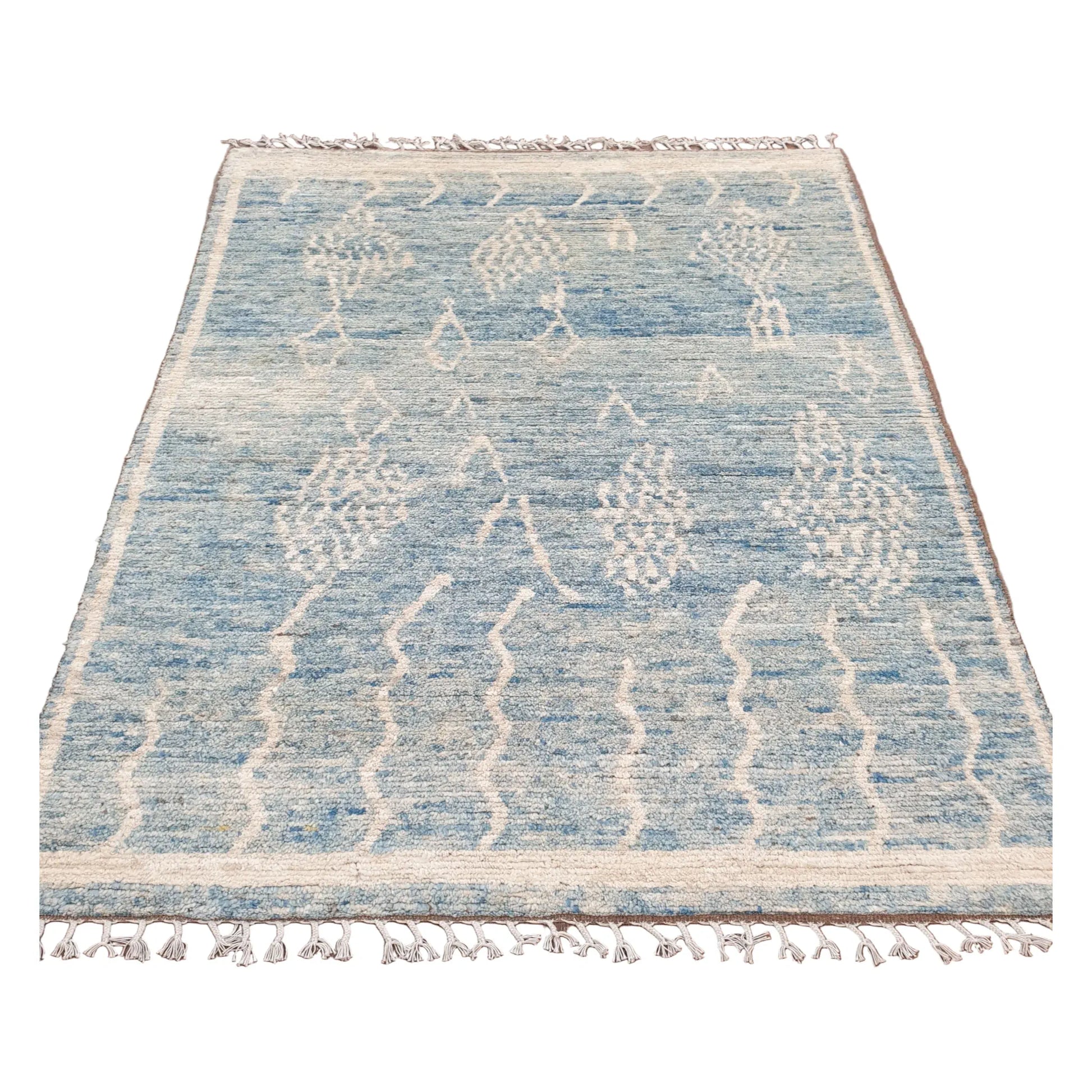 Full view of blue Moroccan wool rug with raised ivory motifs, 240 x 156 cm