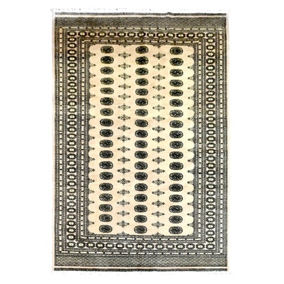 Full view of Bokhara hand-knotted wool rug with an ivory field, olive guls and layered dark borders, 309 x 203 cm