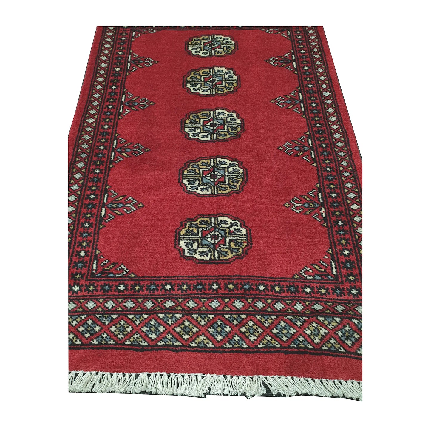 End field and border detail of Bokhara hand-knotted rug showing oval gul motifs, red ground and geometric border work