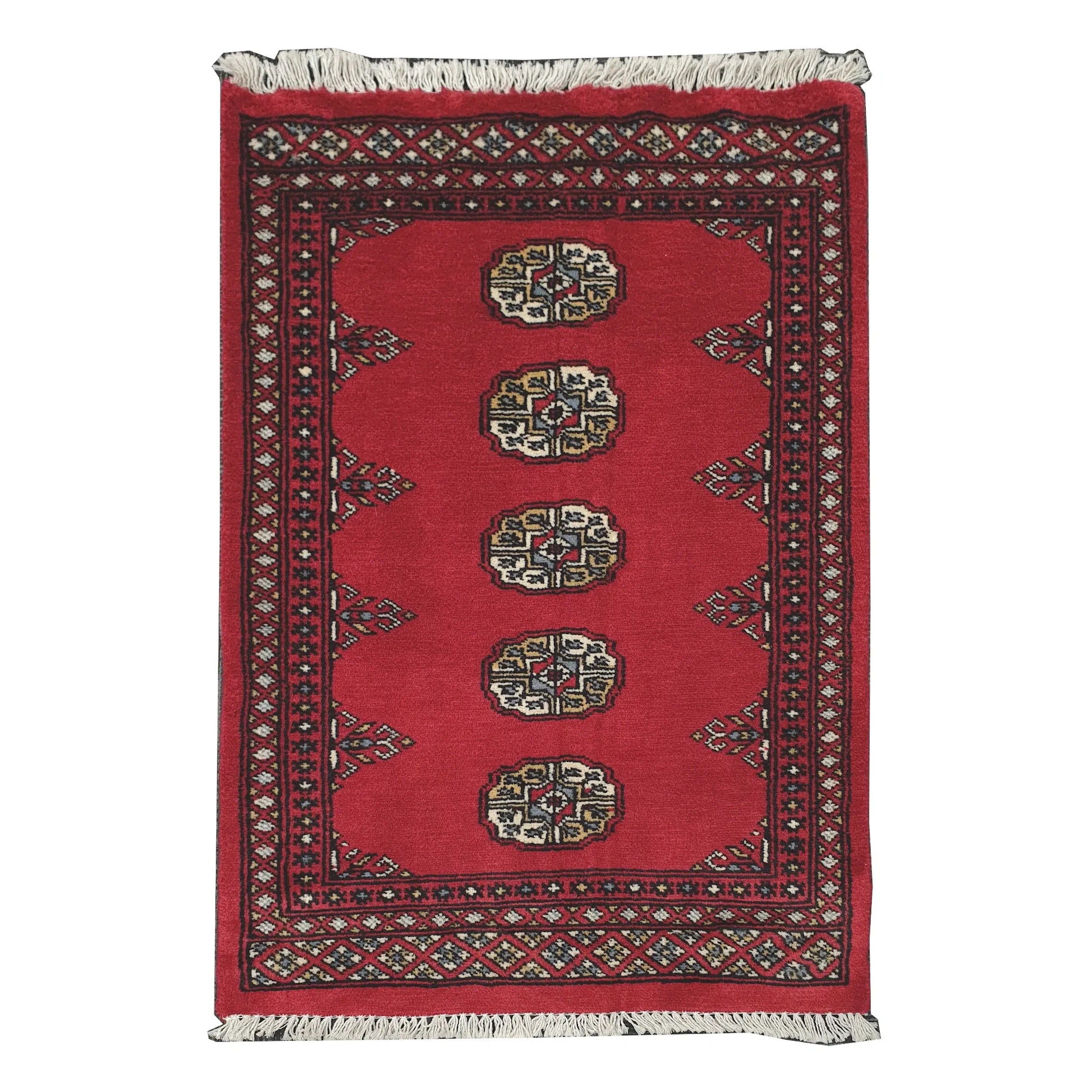 Full view of Bokhara hand-knotted wool rug with rich red field, oval gul-style motifs and geometric border, 98 x 61 cm
