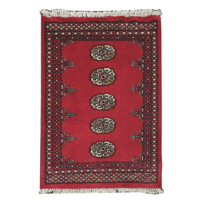 Full view of Bokhara hand-knotted wool rug with rich red field, oval gul-style motifs and geometric border, 98 x 61 cm