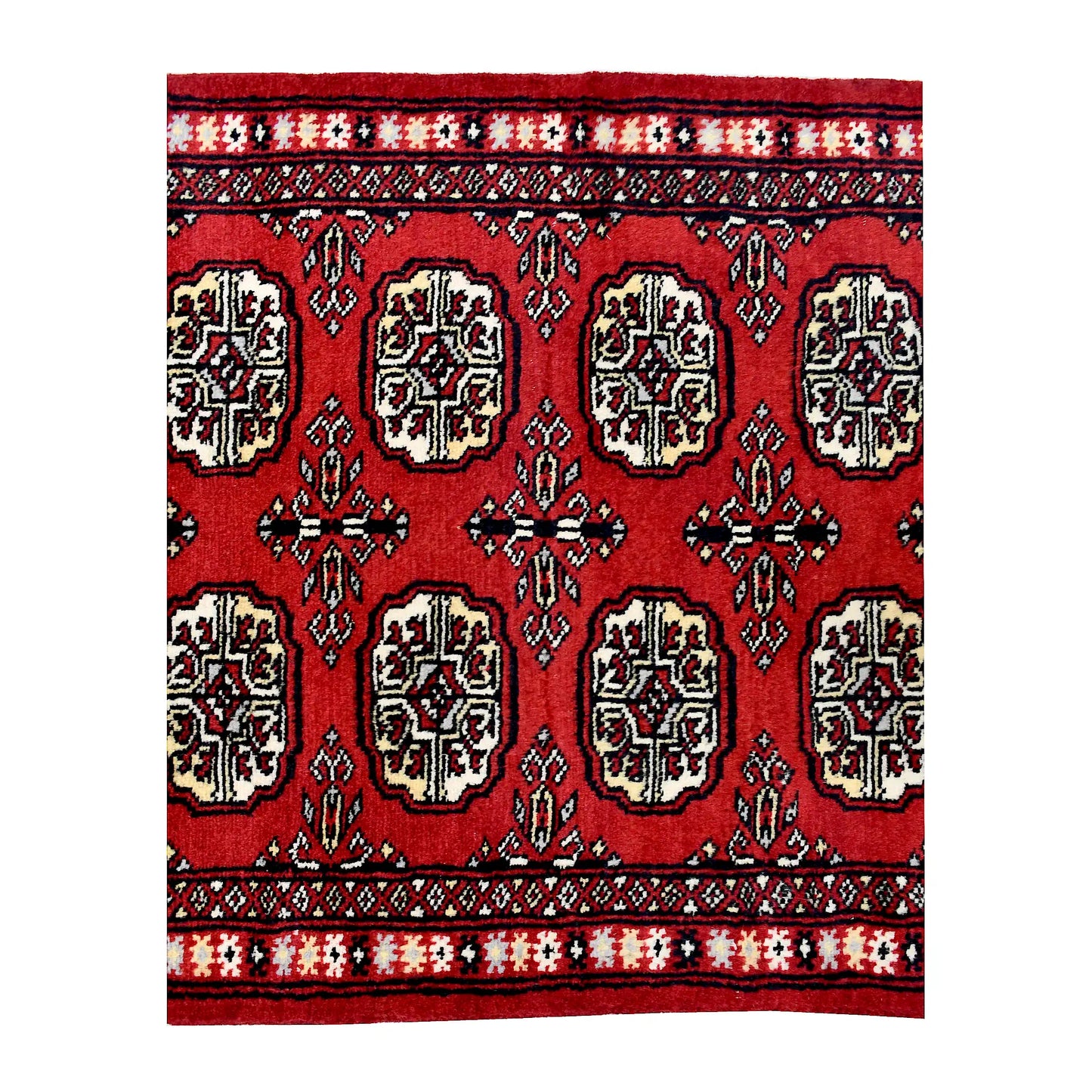 End field and border detail of Bokhara hand-knotted wool runner rug showing red pile, black outlines and ivory accents