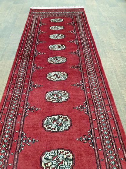 Bokhara runner rug length view showing repeating design