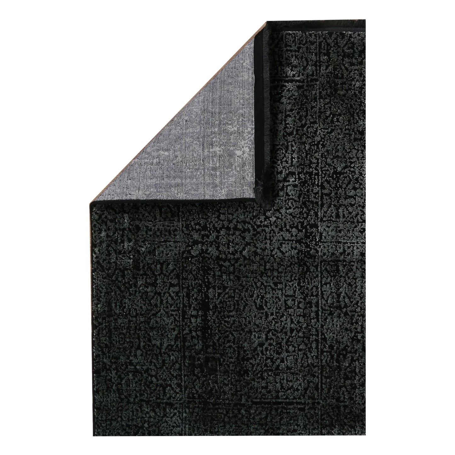 Folded corner detail of Brooklyn 100 emerald mosaic rug showing edge and backing texture