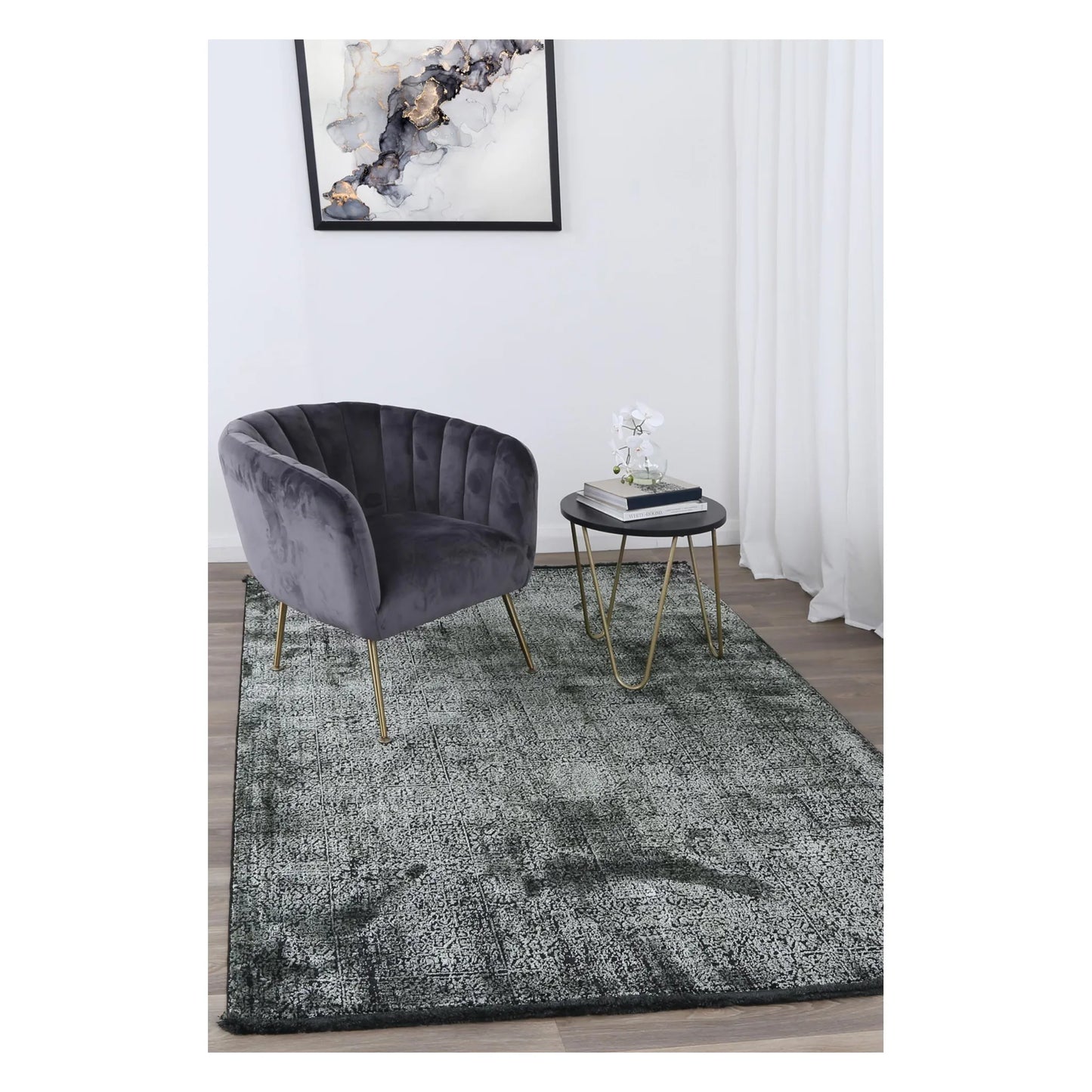 Brooklyn 100 emerald mosaic modern rug styled with charcoal chair and side table