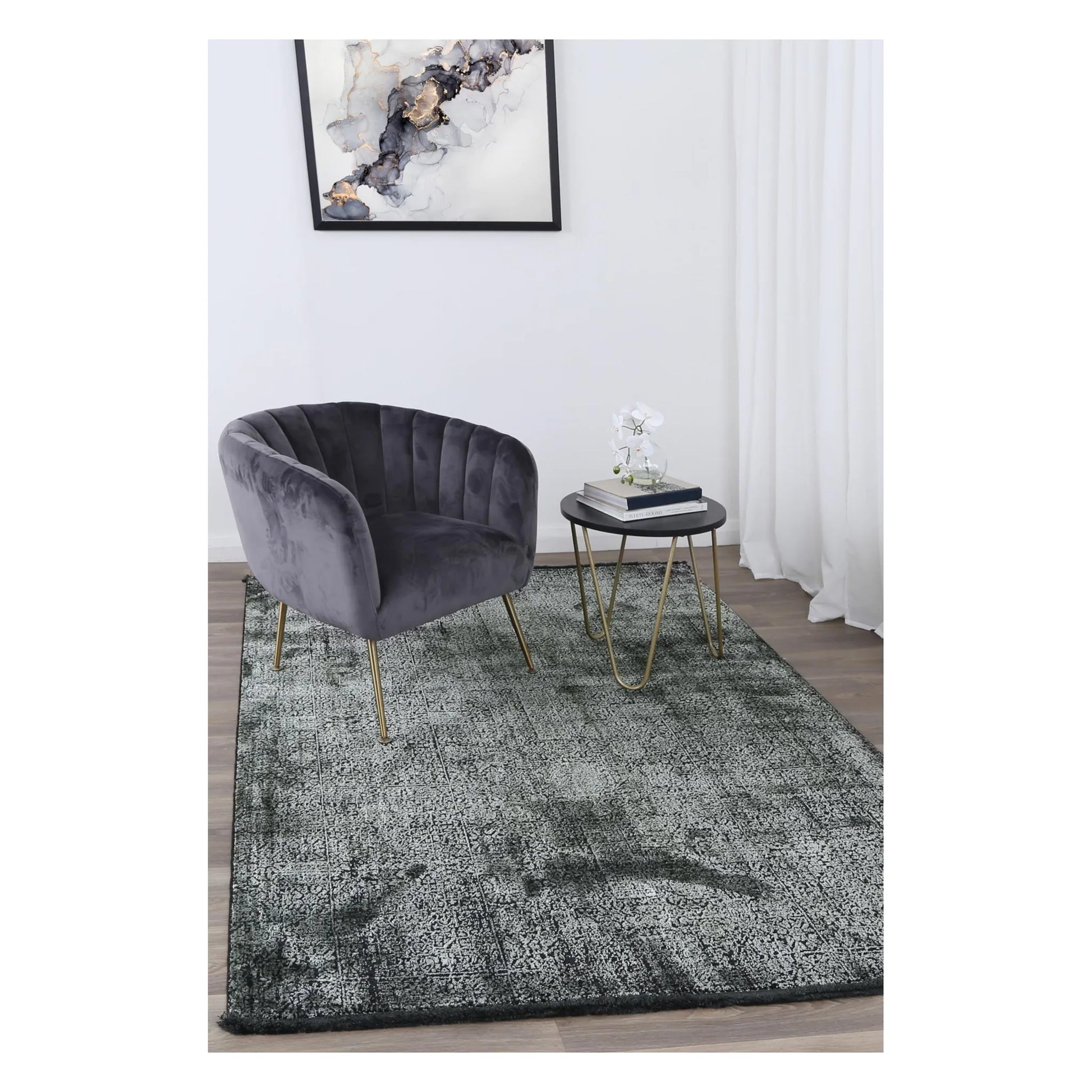 Brooklyn 100 emerald mosaic modern rug styled with charcoal chair and side table