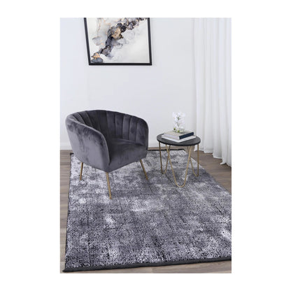 Brooklyn 100 silver mosaic modern rug styled with charcoal chair and side table