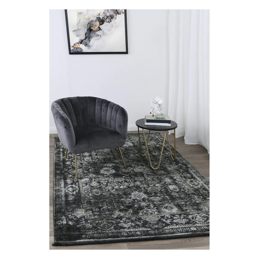 Brooklyn 300 emerald ornate rug styled with charcoal chair and side table