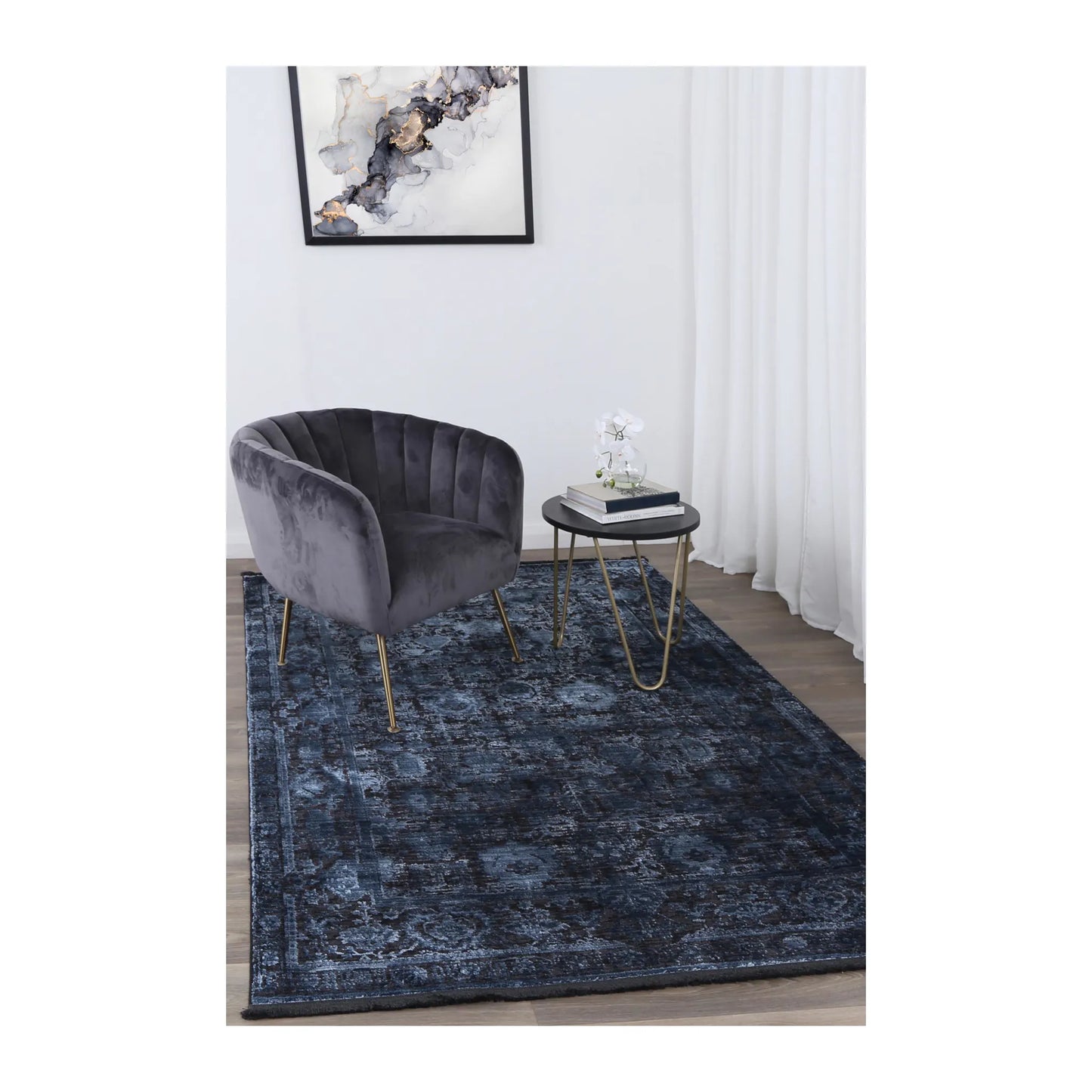 Brooklyn 300 navy blue ornate rug styled with charcoal chair and side table
