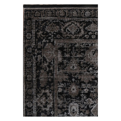 Close view of the raised pewter floral pattern, charcoal field and layered border detail