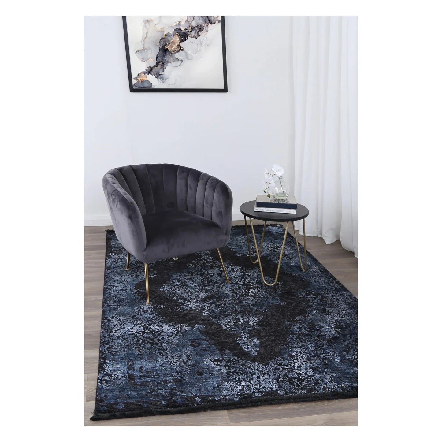 Brooklyn 400 blue medallion modern rug styled with charcoal chair and side table