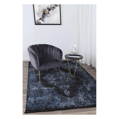 Brooklyn 400 blue medallion modern rug styled with charcoal chair and side table
