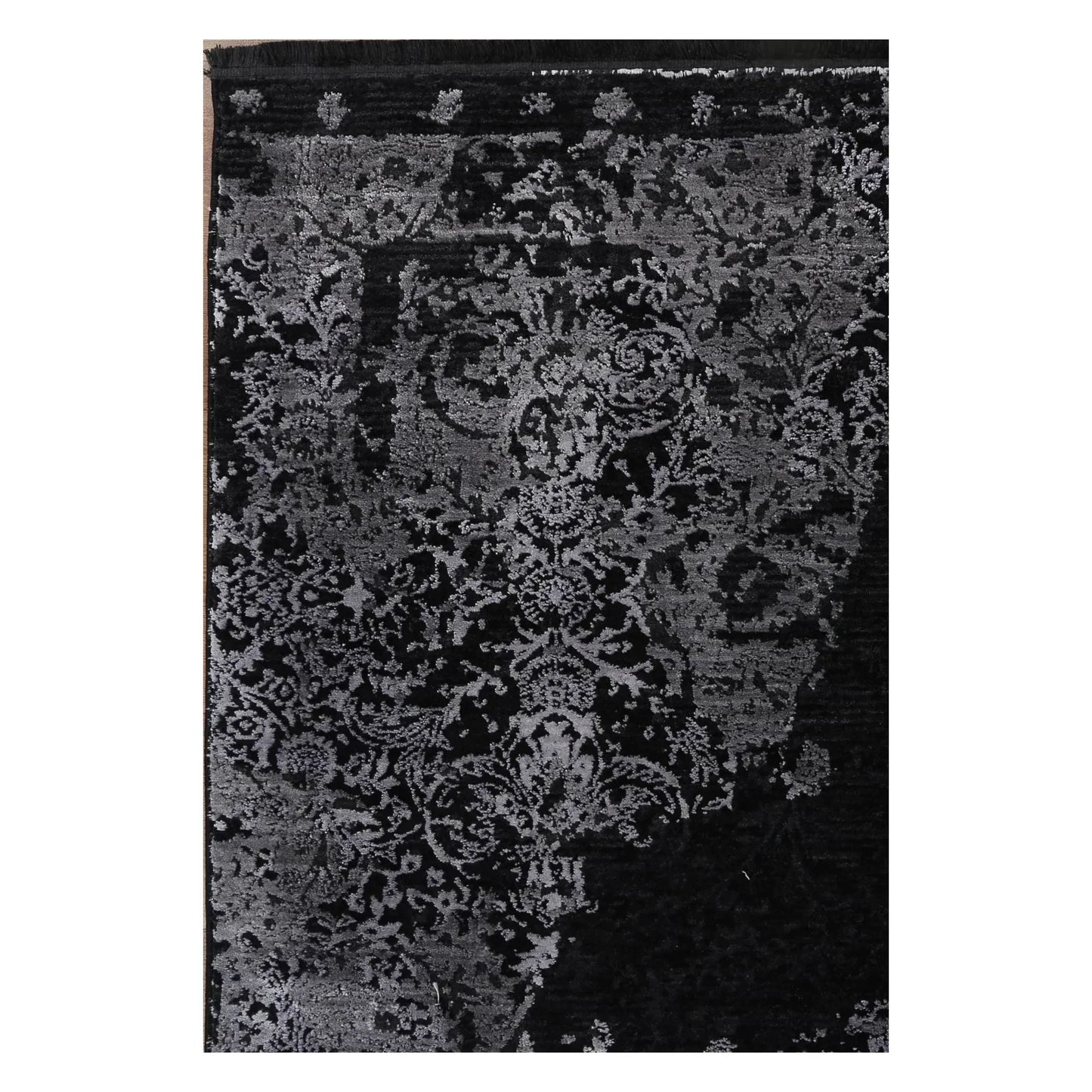 Close view of the raised silver-grey floral pattern and deep black field