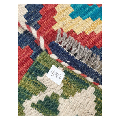 Close-up of Chobi Kilim rug texture, fringe, and multicolour geometric detail, 92 x 62 cm