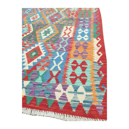 Corner and fringe detail of Chobi Kilim wool rug with multicolour flatwoven pattern and tribal border, 181 x 132 cm