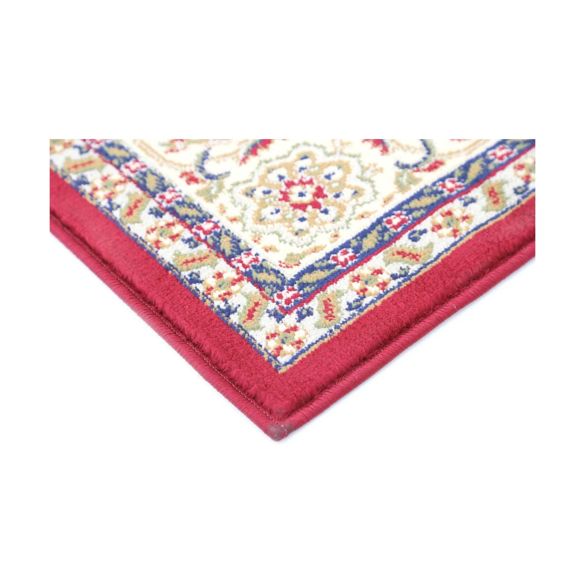 Corner detail of Classica 5771 Red traditional rug showing bound edge, red border and ornamental pattern, 230 x 160 cm