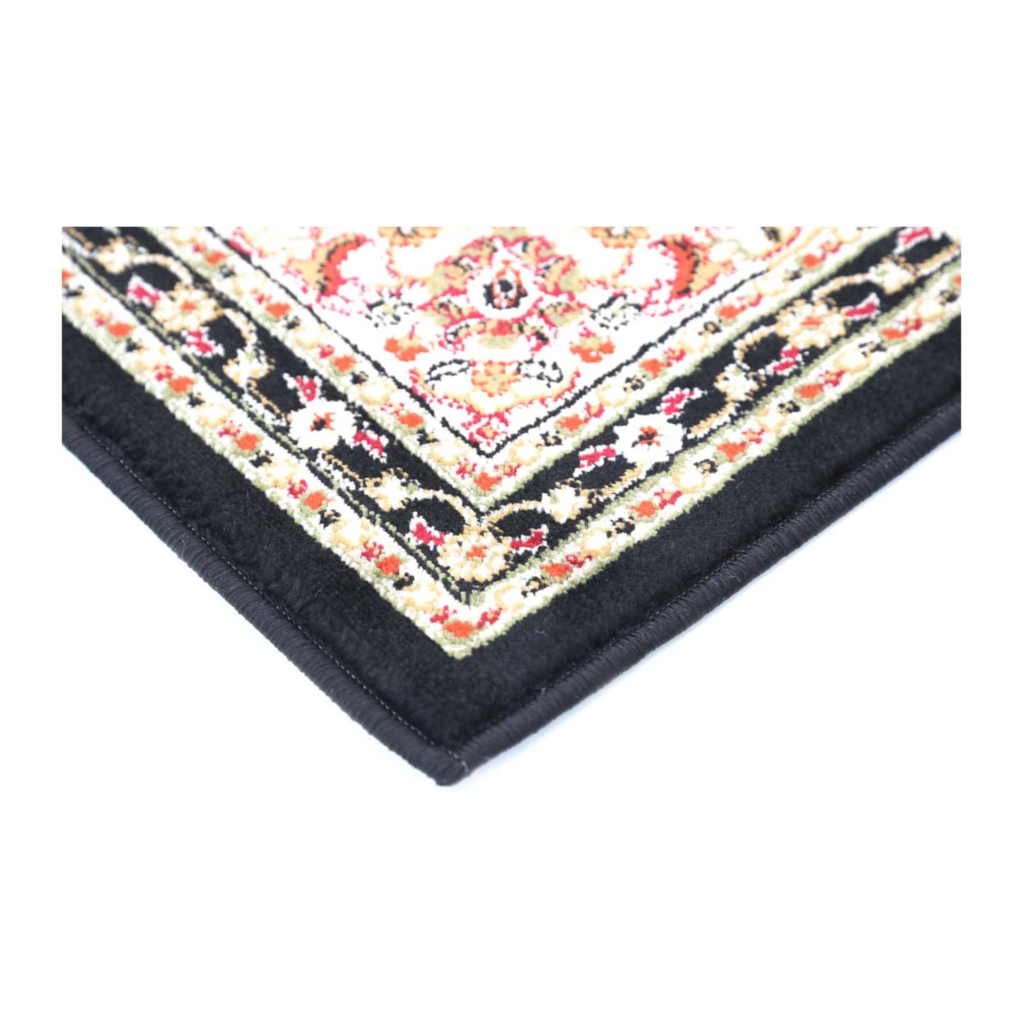 Corner detail of Classica black medallion rug showing floral border and bound edge