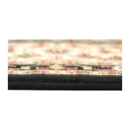 Edge detail of Classica black medallion rug showing pile thickness and woven edge