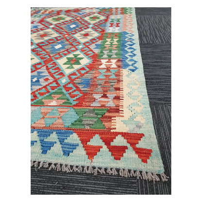 Angled detail of Afghan Chobi Kilim showing fringe, border pattern, and handwoven flatweave texture, 156 x 106 cm